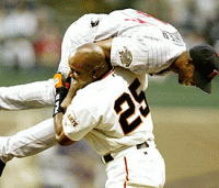 Barry Bonds picks up Torii Hunter after Torii robbed him of a first inning homerun.